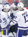  ?? NAM Y. HUH/ THE ASSOCIATED PRESS ?? Toronto Maple Leafs Mitch Marner, left, Nazem Kadri and Patrick Marleau celebrate a goal Wednesday in Chicago.