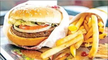  ?? MICHAEL THOMAS/GETTY IMAGES/AFP ?? Items like the ‘Impossible Whopper’ at Burger King are driving a boom in plant-based meat.