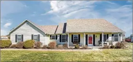  ?? CONTRIBUTE­D PHOTOS ?? The 3-bedroom ranch with about 2,120 square feet of living space features a concrete, covered porch and an attached, 2-car garage.