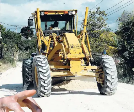  ?? LIONEL ROOKWOOD PHOTOS ?? Roadwork being done in an area close to Douglas Castle, St Ann.