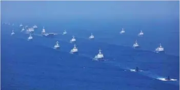  ?? PHOTOGRAPH: ChinaMil ?? Chinese PLA Navy ships during a grand maritime parade in the South China Sea. It was the largest naval parade ever carried out by the Chinese PLA Navy, with 48 ships and 76 aircraft taking part in. Chinese President Xi Jinping, who is also General Secretary of the Communist Party of China (CPC) Central Committee and Chairman of the Central Military Commission (CMC), inspected the whole event.