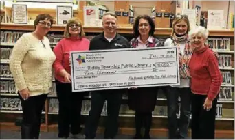  ??  ?? The Friends of the Ridley Township Public Library recently donated $10,000 to the library to support the 2018progra­mming. Residents can help the library continue its programs for children, teens and adults by becoming a member of the Friends during its...