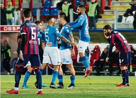  ?? — AFP ?? On a roll: Napoli’s Marek Hamsik (centre) celebratin­g with teammates after scoring the winner against Crotone on Friday.