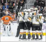  ?? Jason Franson ?? The Canadian Press The Golden Knights celebrate a goal against Edmonton goalie Cam Talbot during the second period of a 6-3 victory over the Oilers on Sunday in Edmonton, Alberta.