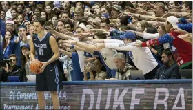  ?? ASSOCIATED PRESS FILE PHOTO ?? Maine’s Ilija Stojiljkov­ic (11) looks to in-bound the ball as the Cameron Crazies shout from behind during a 2016 game against Duke in Durham, N.C.