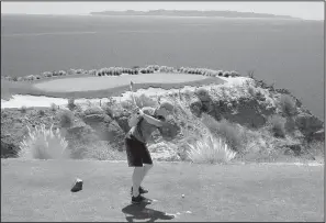  ?? Arkansas Democrat-Gazette/BRYAN HENDRICKS ?? Brandon Hendricks of Long Beach, Calif., (above) tees off on the signature 17th hole at Danzante Bay Golf Club at Villa del Palmar Resort at the Islands of Loreto, Mexico. He parred the hole. The author (left) was ecstatic after catching his first...