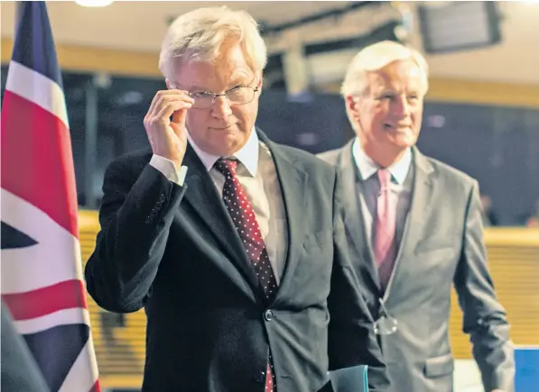  ??  ?? David Davis and Michel Barnier leave a media conference at the EU headquarte­rs in Brussels, after the EU and Britain concluded a fourth round of Brexit negotiatio­ns yesterday