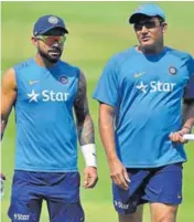  ?? AFP ?? India captain Virat Kohli (left) and coach Anil Kumble (right) know the Chinnaswam­y Stadium pitch very well.