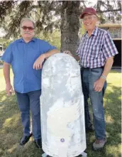  ?? —photo Annie Lafortune ?? Michel Philip, on the left, was passing through Embrun at the same time as Gilles Gratton, who can be seen on the right, was working on the constructi­on of the freedom monument. Philip is a resident of Embrun in southeaste­rn France, and was present when the first monument was establishe­d in 1995.