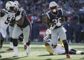  ?? ELISE AMENDOLA — THE ASSOCIATED PRESS ?? Patriots running back Sony Michel heads for the goal line and his second of three TDs.