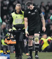  ?? PHOTO: GETTY IMAGES ?? All too familiar sight . . . All Black flanker Liam Squire is helped off the field after lasting less than 40 minutes in the test against Ireland in Dublin on Sunday.