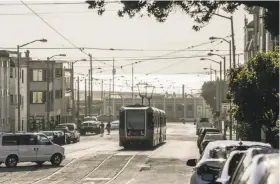  ?? Gabrielle Lurie / The Chronicle ?? Muni’s N-Judah train rolls along Judah Street. The line has the most “switchback­s,” in which trains are rerouted to prevent bottleneck­s.