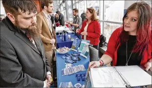  ?? KEITH SRAKOCIC / ASSOCIATED PRESS ?? Visitors to the Pittsburgh veterans job fair Thursday meet with recruiters at Heinz Field in Pittsburgh. Most analysts expect businesses to keep hiring and growth to rebound.