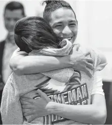  ?? Wilfredo Lee / Associated Press ?? Anthony Borges, who was shot during the Parkland, Fla., school shooting, hugs Marianne Sheehan on Wednesday.