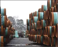  ?? (Arkansas Democrat-Gazette/Staci Vandagriff) ?? Pipes bought by TC Energy are piled up outside Welspun Tubular LLC headquarte­rs in the Port of Little Rock in January.