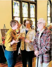  ?? OKLAHOMAN] [PHOTOS BY CARLA HINTON, THE ?? The Rev. Michaele LaVigne, pastor of spiritual formation at Eighth Street Church, visits with Nancy and Hal Cauthron at an open house on March 31 at the newly renovated church building at 701 NW 8.