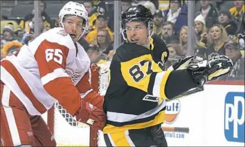  ?? Peter Diana/Post-Gazette ?? Sidney Crosby goes to the net against Detroit’s Danny DeKeyser Saturday.