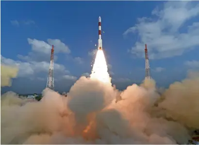  ?? AP ?? Isro’s polar satellite launch vehicle lifting off from the Satish Dhawan Space Centre in Sriharikot­a on Wednesday. —