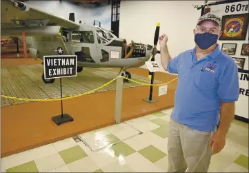  ?? PHOTOS BY JOEL ROSENBAUM — THE REPORTER ?? David Trojan, a volunteer with the Travis Air Force Base Heritage Center gestures as speaks about an O-2A Super Skymaster a Vietnam-era aircraft that is part of the new exhibit as he leads a tour Monday at the museum. The plane was used to direct close air-support strikes during the war and subject to small arms fire from the jungle floor and was lost at a large rate. Volunteers at the museum spent 10 years restoring the aircraft.