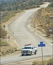  ?? Dan Watson/ The Signal ?? A truck drives down from the hills where the Ridge Route joins Highway 138 near Quail Lake.