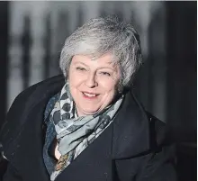  ?? LEON NEAL GETTY IMAGES ?? British Prime Minister Theresa May returns to Downing Street after the confidence vote in her leadership on Wednesday in London, England.