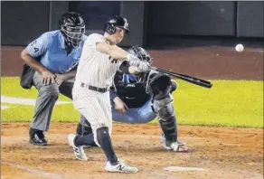  ?? Frank Franklin II / Associated Press ?? New York Yankees’ Brett Gardner hits a two-run home run during the fourth inning against the Toronto Blue Jays on Thursday.