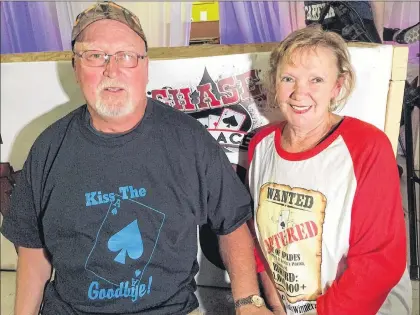  ?? JOE GIBBONS/THE TELEGRAM ?? Chase the Ace jackpot winners Marg and Don Gorman sport celebrator­y T-shirts in the Goulds Wednesday night.