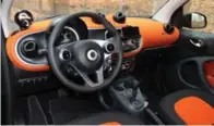  ??  ?? The Smart Fortwo Passion’s interior is available in all black, black on white or this eye-catching black on orange.