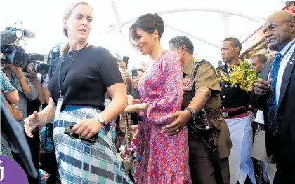  ?? Photo / AP ?? Meghan, Duchess of Sussex, is welcomed by locals at a market in Suva yesterday.