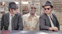  ?? COURTESY OF UNIVERSAL PICTURES ?? Ray Charles is just one of the music legends who will jam with Dan Aykroyd (left) and John Belushi when “The Blues Brothers” rocks the drive-in on April 29.