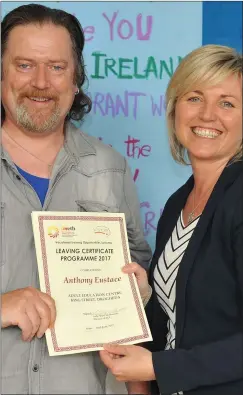  ??  ?? Anthony Eustace receives his certificat­e for Leaving Certificat­e Programme from Cllr. Sharon Tolan, Vice Chairperso­n of LMETB at the LMETB VTOS presentati­on of awards held in King Street.