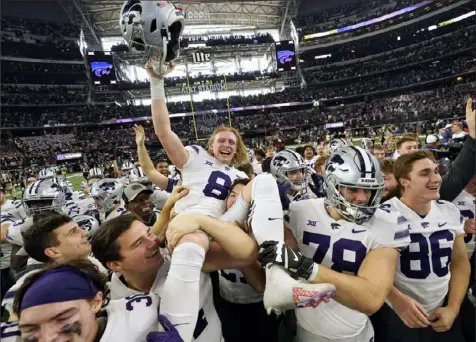  ?? LM Otero/Associated Press ?? Kansas State’s Ty Zentner is carried off by teammates after making a game-winning 31-yard field goal in overtime Saturday to beat No. 3 TCU and win the Big 12 championsh­ip for the Wildcats in Arlington, Texas.