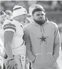  ?? BILL STREICHER / USA TODAY SPORTS ?? Cowboys quarterbac­k Dak Prescott, left, and running back Ezekiel Elliott take their football very seriously. But they’re not troubled by having a little fun, too.