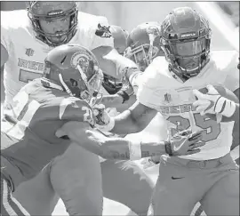  ?? Jayne Kamin-Oncea Getty Images ?? USC SAFETY Isaiah Pola-Mao, left, attempts to tackle Nevada Las Vegas running back Xzaviar Campbell on Saturday during the Trojans’ 43-21 victory.