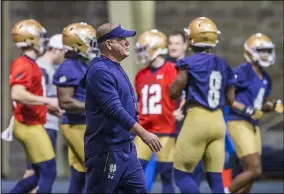  ?? ROBERT FRANKLIN — ASSOCIATED PRESS ?? Notre Dame coach Brian Kelly walks on the field during a 2019 spring practice in South Bend, Ind.