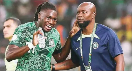  ?? ?? Interim Super Eagles Head Coach, Finidi George (right) discussing game plan with defender Calvin Bassey during the AFCON 2023 in Côte d'Ivoire