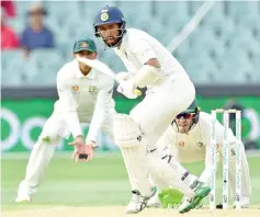  ??  ?? India’s batsman Cheteshwar Pujara (C) bats against Australia during day three of the first Test cricket match at the Adelaide Oval on December 8, 2018. - AFP photo