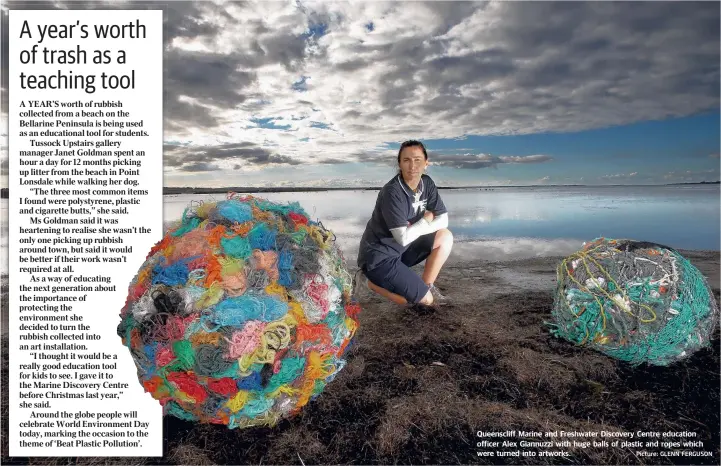  ?? Picture: GLENN FERGUSON ?? Queensclif­f Marine and Freshwater Discovery Centre education officer Alex Giannuzzi with huge balls of plastic and ropes which were turned into artworks.