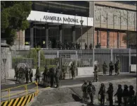  ?? (AP/Dolores Ochoa) ?? Security forces guard the National Assembly Wednesday in Quito, Ecuador.