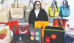  ?? JOHN MAHONEY ?? Sylvia Feldzamen poses with Syfel's antimicrob­ial shopping bags at her business in Dollard-des-ormeaux. Her business continues to grow as grocery chains and retail businesses adopt her products.