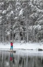  ?? Photos by Ryan Salm ?? Jake Lamberth paddles through Lake Tahoe’s morning mist in Carnelian Bay, top, and gets on the water in time for sunrise near Tahoe City, above left. Lauren Bobowski, above right, takes her stand-up board on the Truckee River.