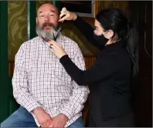  ??  ?? At the beginning……Niall O’Hanrahan during his beard shave in aid of the Palliative Care Teams with his niece Rachel Keenan and right, The end is in sight as Niall’s niece, Rachel Keenan shaves off the last of his beard