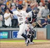  ?? DAVID J. PHILLIP/AP ?? Jose Altuve is pumped up after his third home run of the game in the Astros’ 8-2 rout of the Red Sox in Game 1.