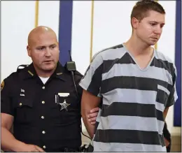  ??  ?? Accused: Officer Ray Tensing is led into court yesterday