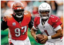  ??  ?? The Bengals are facing a mobile quarterbac­k for the second week in a row and hoping it goes better than it did against Arizona’s Kyler Murray (left). Baltimore’s Lamar Jackson (right) is among the league’s top 20 rushers this season and is the top running quarterbac­k.