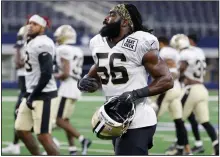  ?? (AP/Michael Ainsworth) ?? Linebacker Demario Davis (Arkansas State) and the New Orleans Saints practiced Monday at AT&T Stadium in Arlington, Texas. Displaced by Hurricane Ida in Louisiana, the Saints are practicing at the home stadium of the Dallas Cowboys through Wednesday.