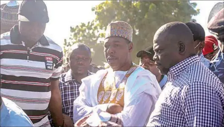  ??  ?? Babagana Zulum ( middle) during burial of Borno State farmers killed by Boko Haram terrorists… yesterday.