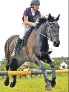  ??  ?? Reserve champion at 90cm, Eilidh McNeil and Corrie in action.