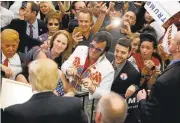  ?? JOHN LOCHER/ASSOCIATED PRESS ARCHIVES ?? Republican presidenti­al candidate Donald Trump meets with supporters in February at a campaign rally in Las Vegas.