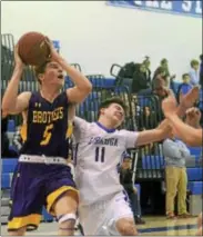  ?? DAVID M. JOHNSON - DJOHNSON@DIGITALFIR­STMEDIA.COM ?? CBA’s Peter O’Toole drives to the hoop as Saratoga Springs’ Nick Chudy defends during a Suburban Council boys basketball game Dec. 5, 2017 at Saratoga Springs High School.